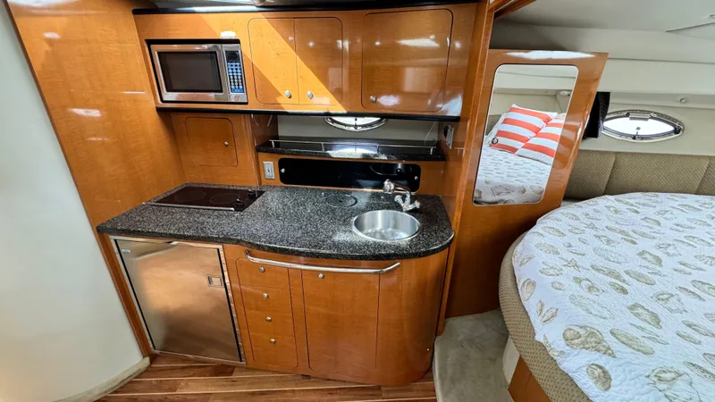 Slide: The Image of Interior of Chaparral Signature 350 yacht, kitchen and sleeping area, year 2007. - 48