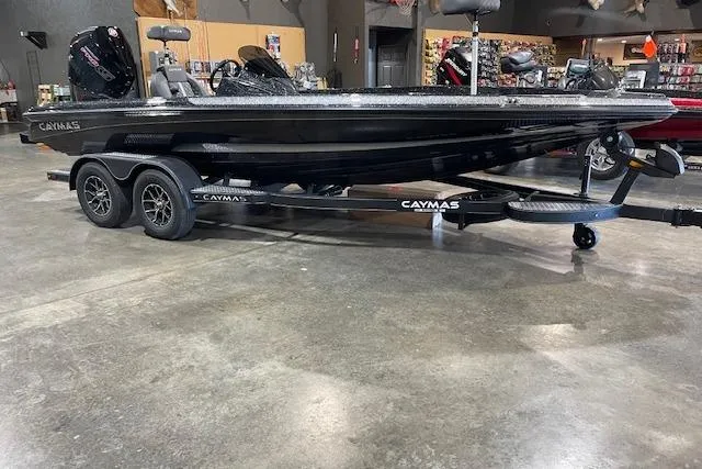 The Image of 2027 Caymas 201 Pro boat on trailer in showroom setting. - 0