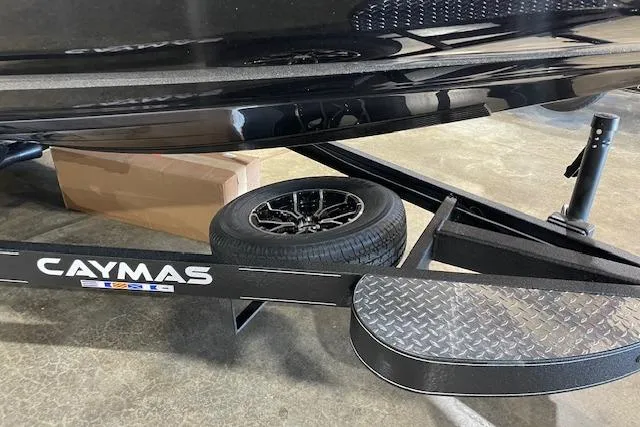 Slide: The Image of 2027 Caymas 201 Pro boat trailer with spare tire and diamond plate step. - 2
