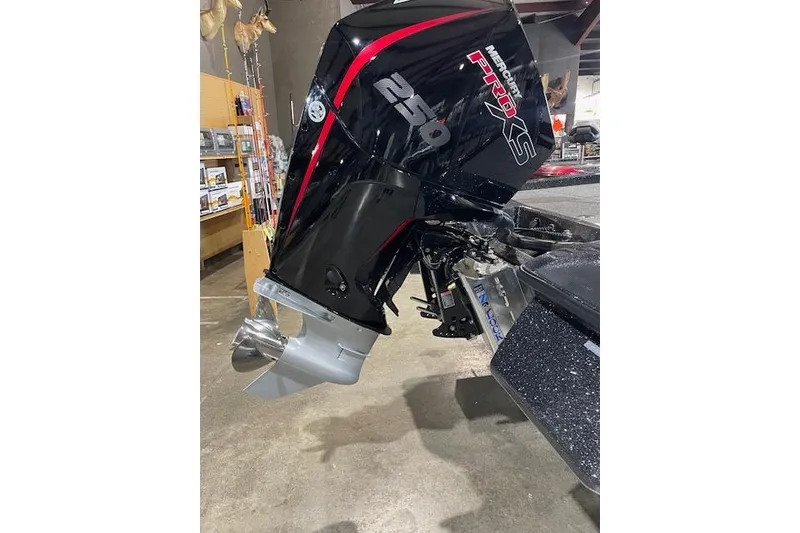 Slide: The Image of 2027 Caymas 201 Pro boat with Mercury Pro XS 250 engine in showroom. - 3