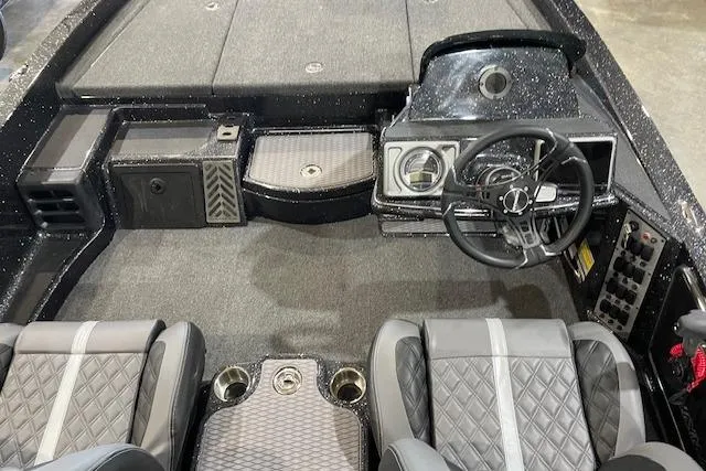 Slide: The Image of Interior of 2027 Caymas 201 Pro boat with modern dashboard and seating. - 8