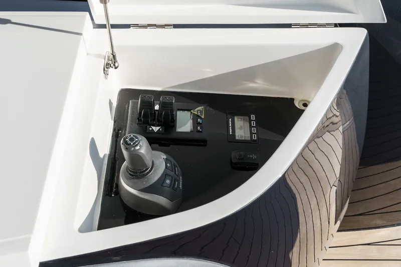 Slide: The Image of Control panel of 2026 Princess V55 yacht, featuring joystick and digital displays. - 14
