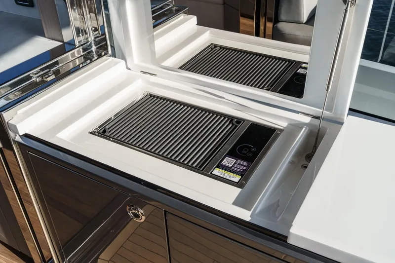 Slide: The Image of Outdoor grill on 2026 Princess V55 yacht, featuring sleek design and modern amenities. - 15