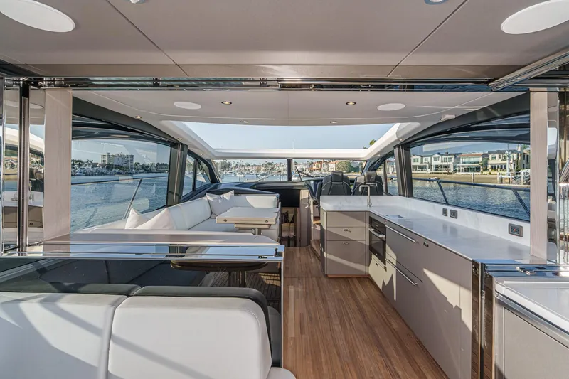 Slide: The Image of Luxurious interior of 2026 Princess V55 yacht with modern kitchen and seating area. - 18