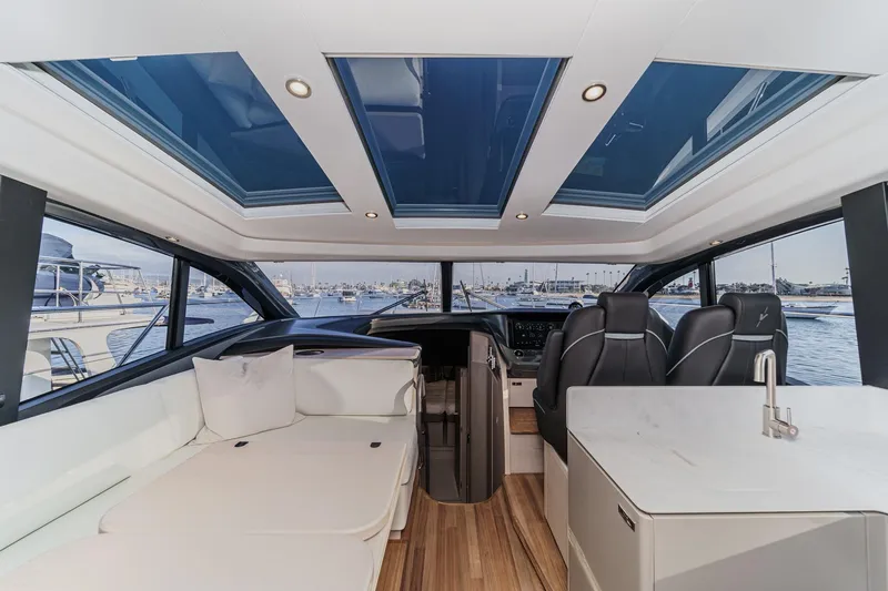Slide: The Image of Luxurious interior of 2026 Princess V55 yacht with panoramic windows and modern seating. - 21