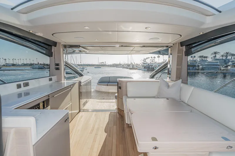 Slide: The Image of Luxurious 2026 Princess V55 yacht interior with modern design and waterfront view. - 23