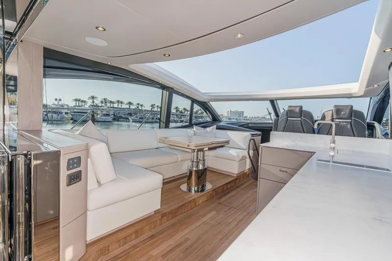Slide: The Image of Luxurious interior of 2026 Princess V55 yacht with modern seating and panoramic windows. - 26