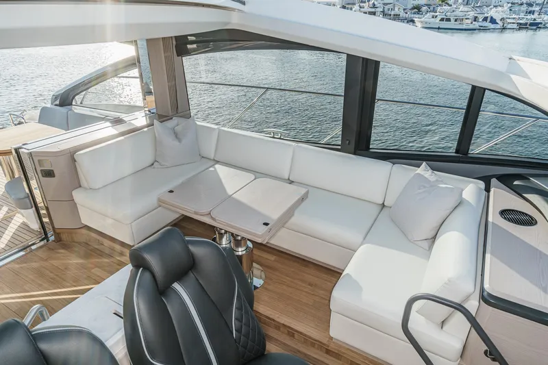 Slide: The Image of Luxurious interior of 2026 Princess V55 yacht with white seating and scenic water view. - 27