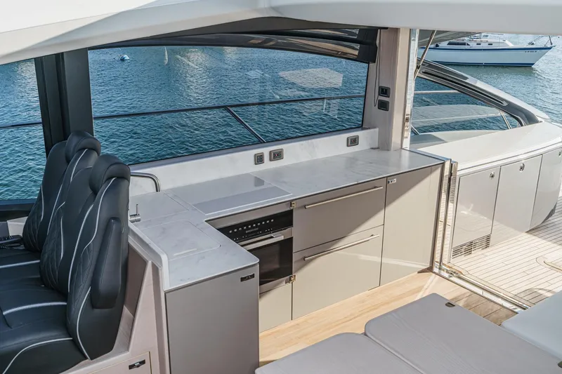 Slide: The Image of Luxurious interior of 2026 Princess V55 yacht with modern kitchen and seating. - 31