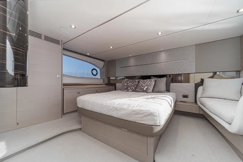 Slide: The Image of Luxurious bedroom interior of 2026 Princess V55 yacht with modern design and elegant furnishings. - 37