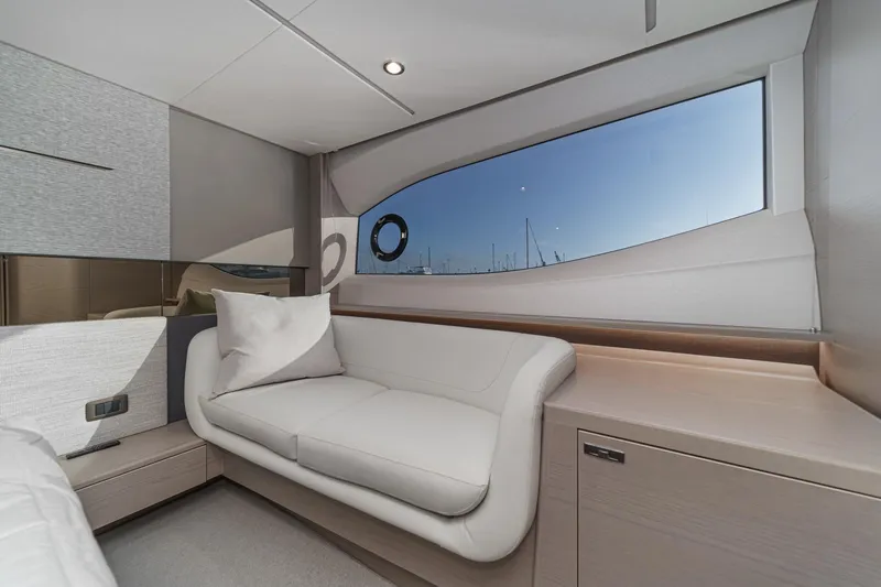 Slide: The Image of Luxurious interior of 2026 Princess V55 yacht with elegant seating and large window view. - 38