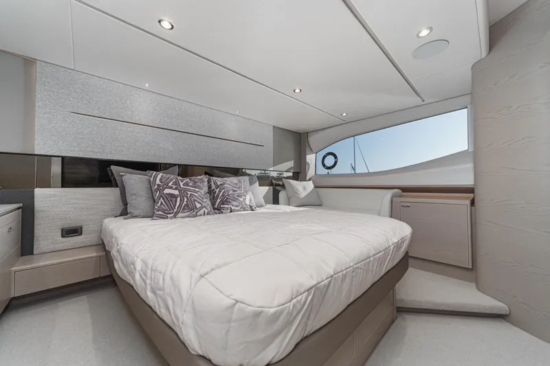 Slide: The Image of Luxurious bedroom interior of 2026 Princess V55 yacht with modern design and elegant decor. - 39