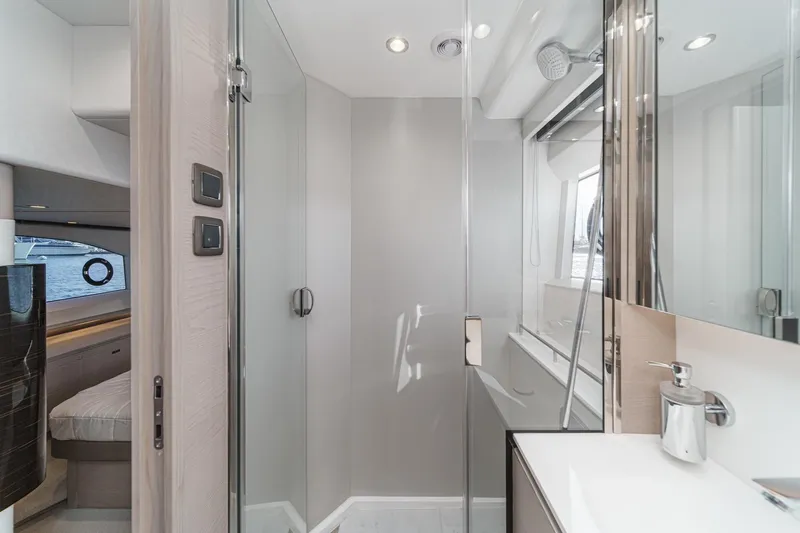 Slide: The Image of Luxurious bathroom interior on 2026 Princess V55 yacht, featuring modern fixtures and sleek design. - 42