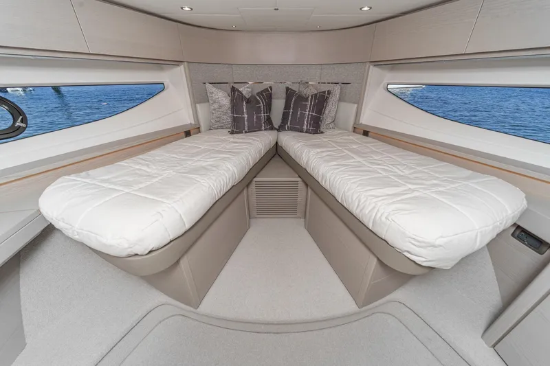 Slide: The Image of Luxurious cabin interior of 2026 Princess V55 yacht with twin beds and ocean view. - 43