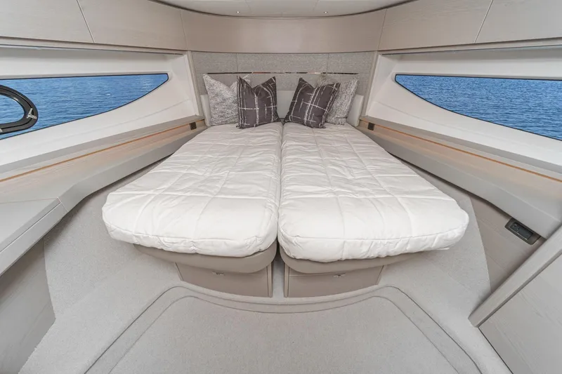 Slide: The Image of Luxurious interior of 2026 Princess V55 yacht with twin beds and ocean view. - 44