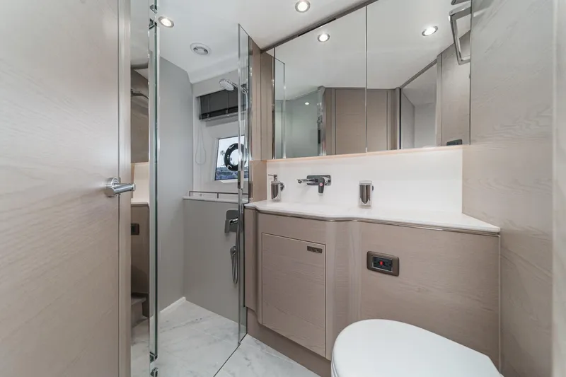 Slide: The Image of Luxurious bathroom interior of 2026 Princess V55 yacht, featuring modern fixtures and elegant design. - 46