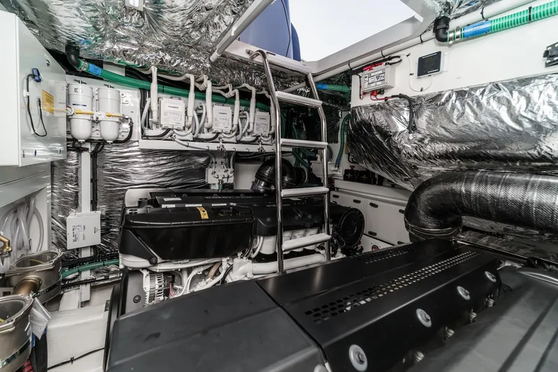 Slide: The Image of Engine room of 2026 Princess V55 yacht, featuring advanced machinery and metallic insulation. - 51