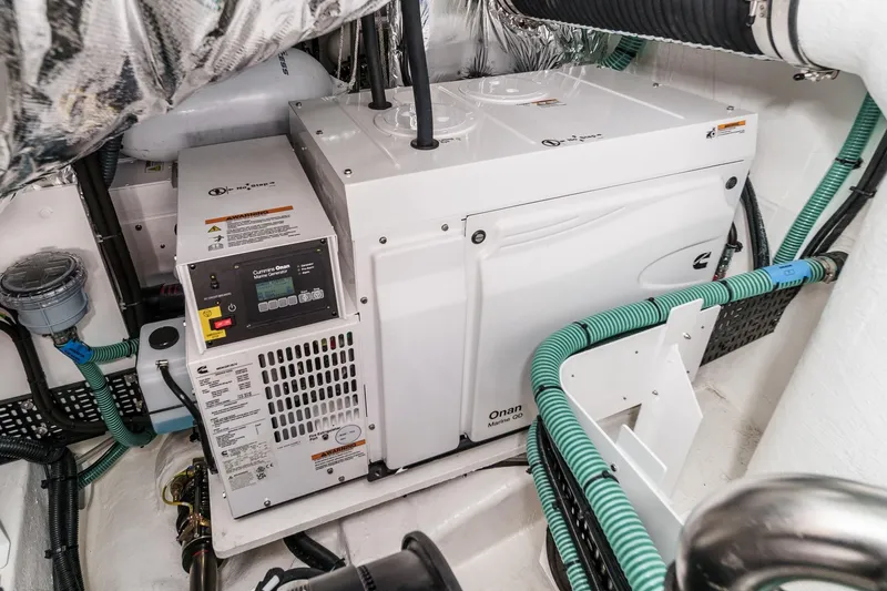 Slide: The Image of Engine room of 2026 Princess V55 yacht with Cummins Onan Marine generator. - 53