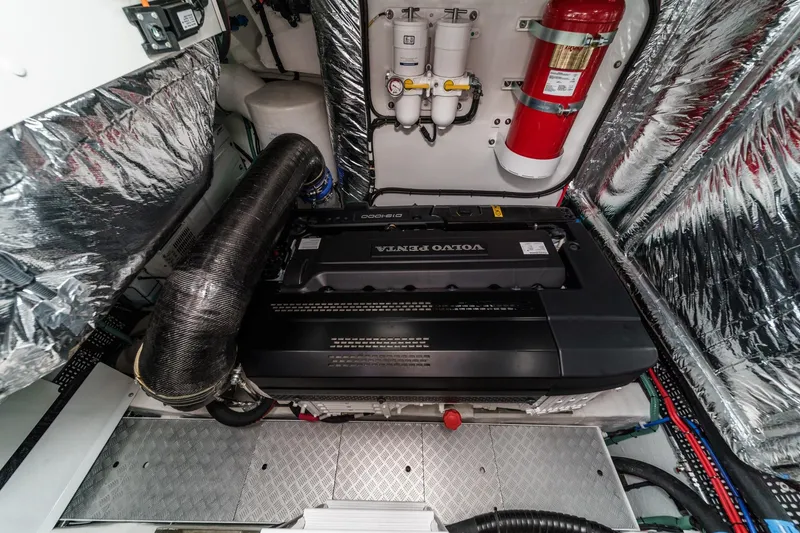 Slide: The Image of Engine room of 2026 Princess V55 yacht with Volvo Penta engine and fire extinguisher. - 54