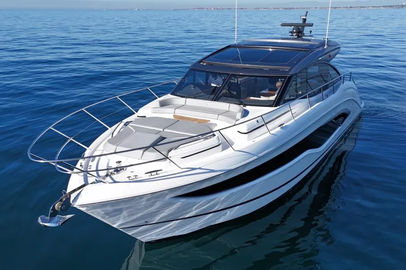 Slide: The Image of 2026 Princess V55 yacht cruising on calm blue waters. - 6