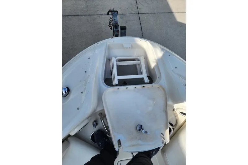 Slide: The Image of 2008 Sea Ray 240 Sundeck boat interior with seating and storage area. - 10