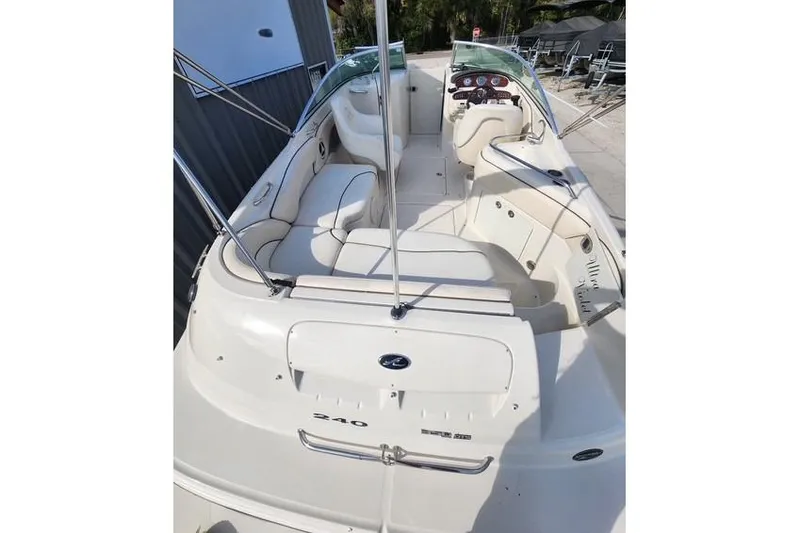 Slide: The Image of 2008 Sea Ray 240 Sundeck boat interior with seating and dashboard view. - 7