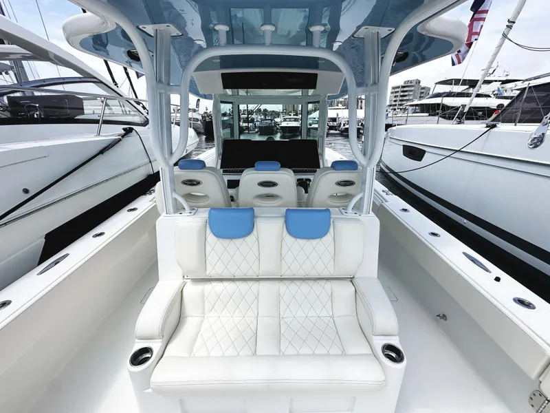 Slide: The Image of 2018 HCB 39 Speciale luxury boat interior with white seating and blue accents. - 11