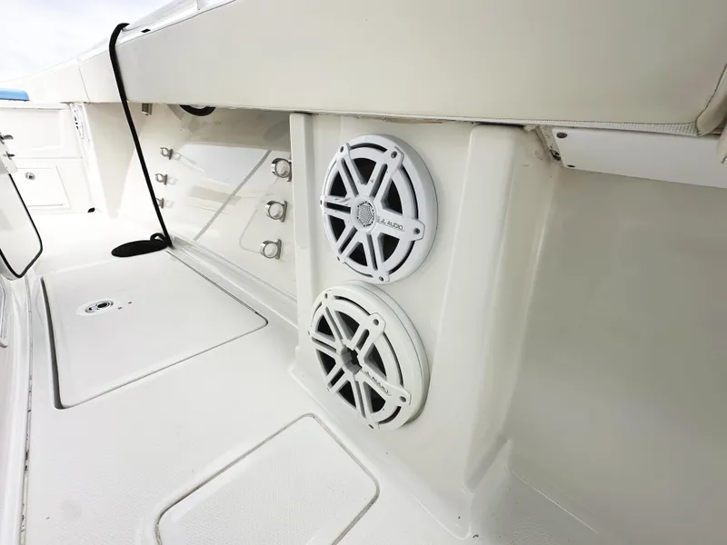 Slide: The Image of 2018 HCB 39 Speciale boat interior with speakers and storage compartments. - 27