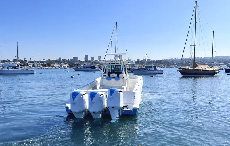 Slide: The Image of 2018 HCB 39 Speciale boat with triple engines on a sunny harbor. - 4