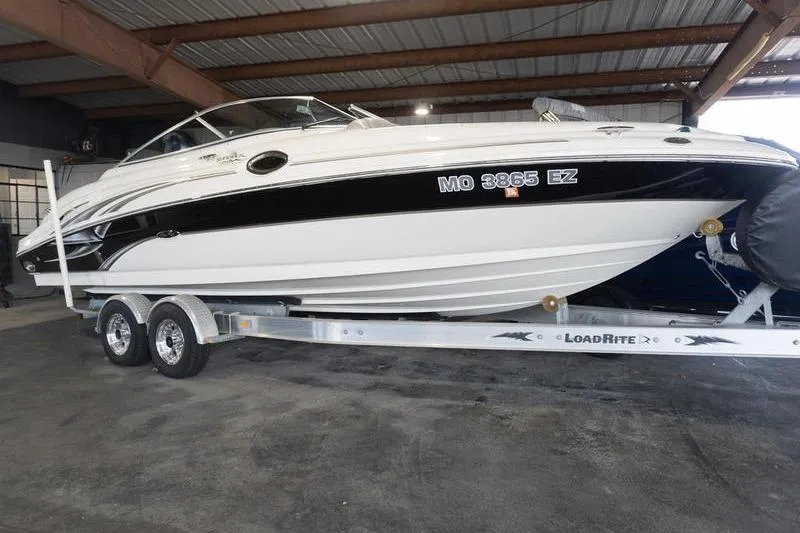 The Image of 2002 Sea Ray 270 Sundeck boat on Load Rite trailer in covered storage. - 0