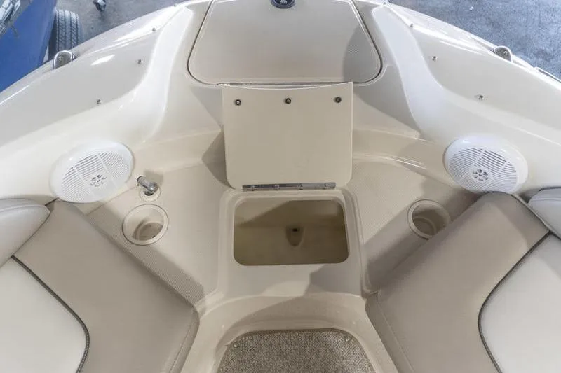 Slide: The Image of Interior view of a 2002 Sea Ray 270 Sundeck boat with seating and speakers. - 10