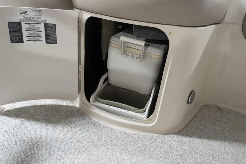 Slide: The Image of Storage compartment with cooler on a 2002 Sea Ray 270 Sundeck boat. - 14