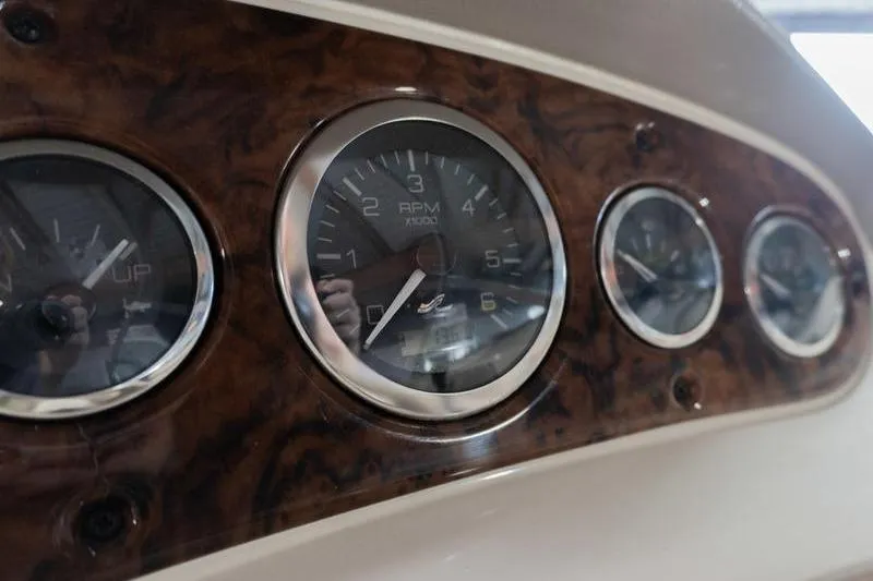 Slide: The Image of Dashboard gauges of a 2002 Sea Ray 270 Sundeck boat. - 19