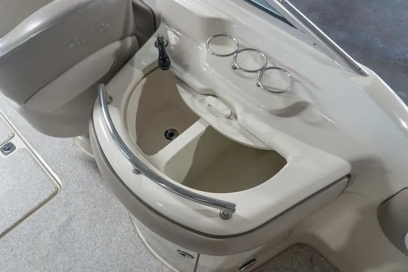 Slide: The Image of 2002 Sea Ray 270 Sundeck boat interior with sink and cup holders. - 20