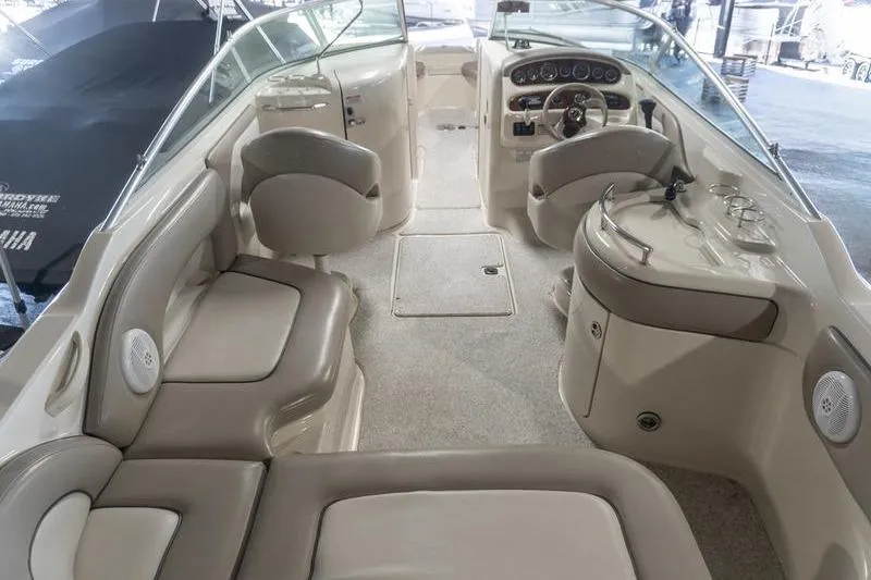 Slide: The Image of Interior view of 2002 Sea Ray 270 Sundeck boat with seating and helm. - 5