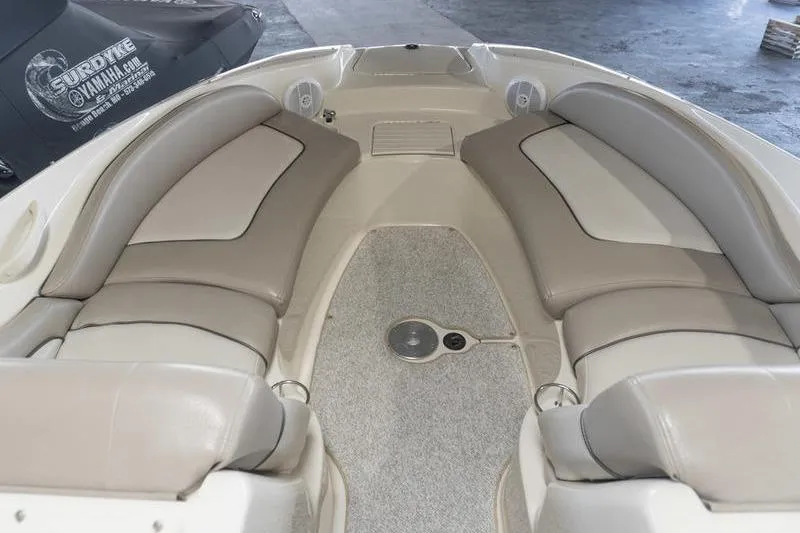 Slide: The Image of Interior view of a 2002 Sea Ray 270 Sundeck boat with beige seating. - 6