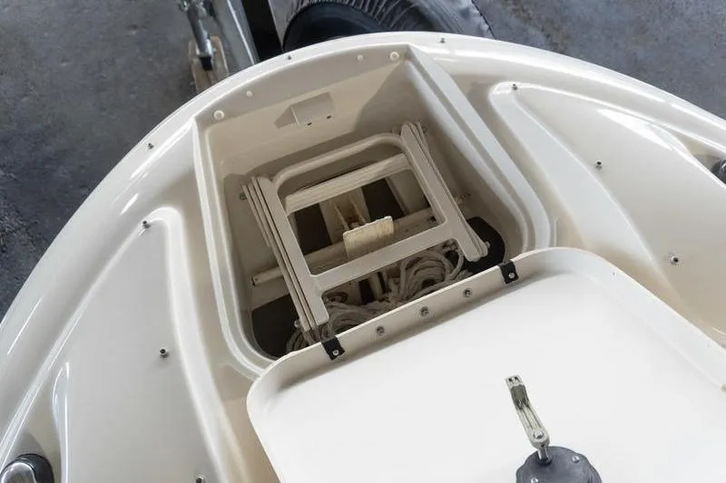 Slide: The Image of Bow storage compartment of 2002 Sea Ray 270 Sundeck with ladder and rope. - 9