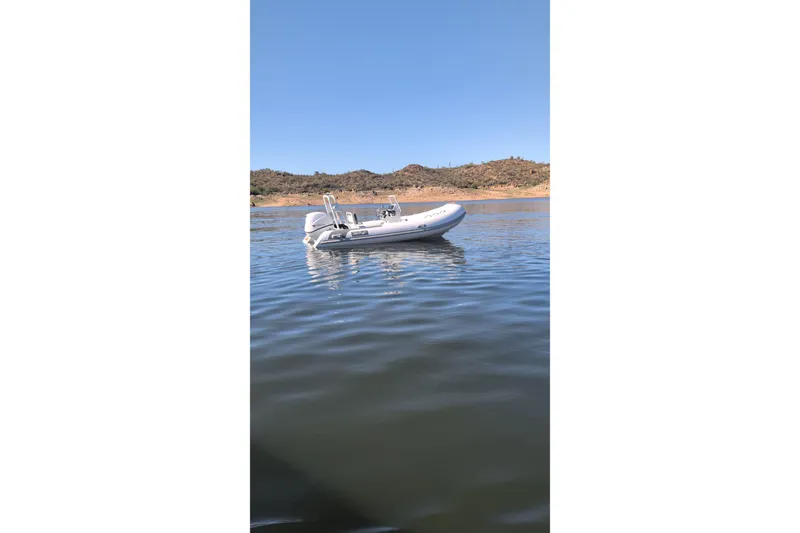 Slide: The Image of Tide Craft Catalina 13 boat floating on calm water, 2026 model. - 9