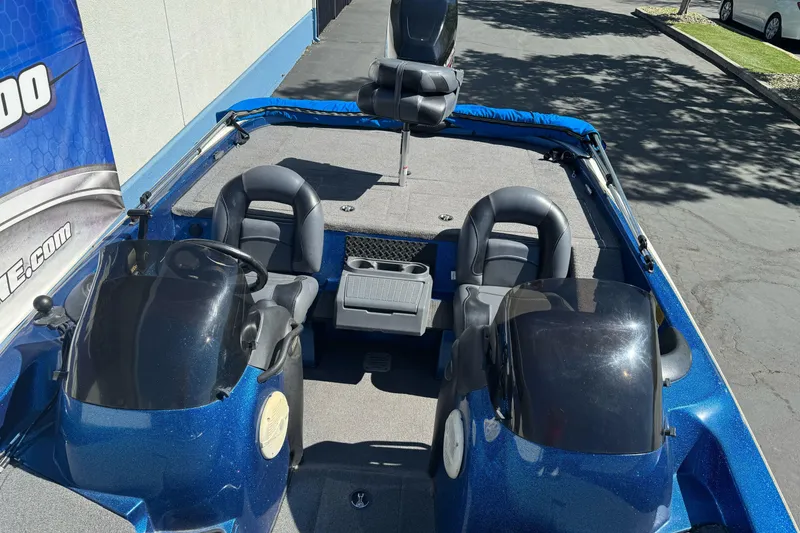 Slide: The Image of 2000 Nitro 901 CDX DC boat interior with dual consoles and seating. - 13