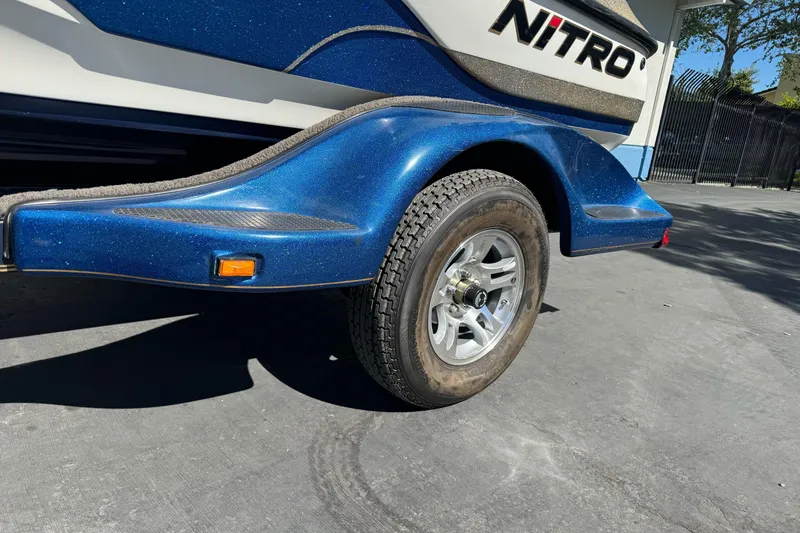 Slide: The Image of Blue Nitro 901 CDX DC trailer, 2000 model, with visible wheel and fender detail. - 3
