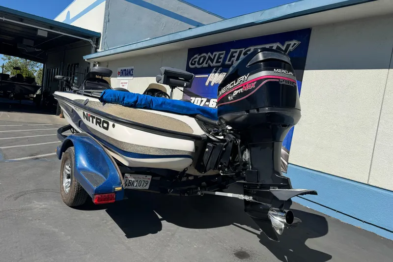 Slide: The Image of 2000 Nitro 901 CDX DC boat with Mercury OptiMax engine on trailer. - 8