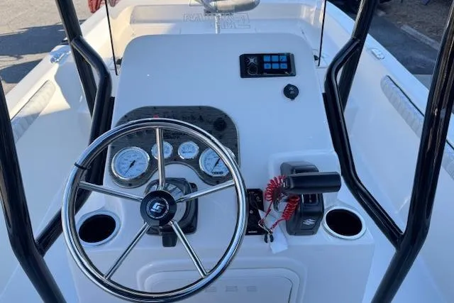 Slide: The Image of 2026 Carolina Skiff 21 LS boat console with steering wheel and gauges. - 13