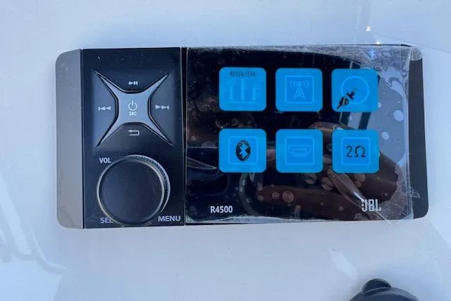 Slide: The Image of Control panel of JBL R4500 audio system on 2026 Carolina Skiff 21 LS boat. - 14