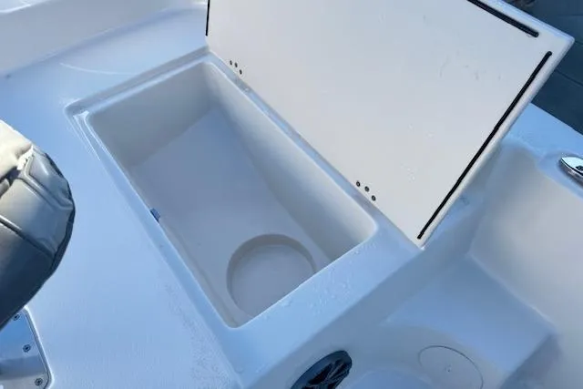 Slide: The Image of Open storage compartment on 2026 Carolina Skiff 21 LS boat. - 18