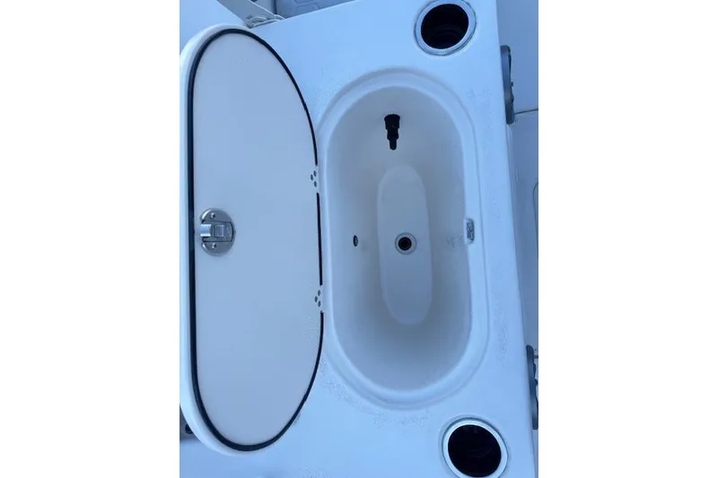 Slide: The Image of Livewell compartment on a 2026 Carolina Skiff 21 LS boat. - 19