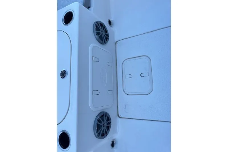 Slide: The Image of Interior view of 2026 Carolina Skiff 21 LS boat, featuring storage compartments and speakers. - 20