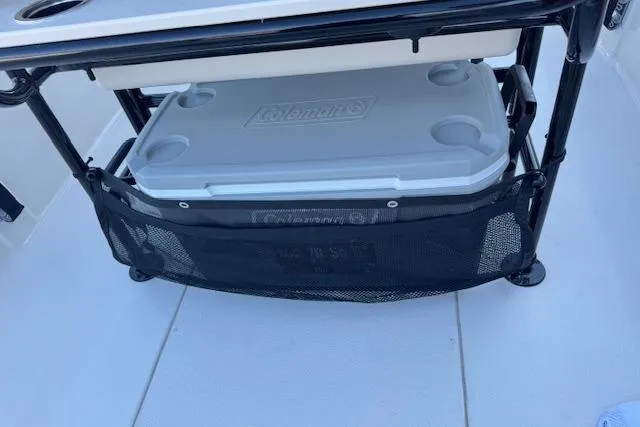 Slide: The Image of 2026 Carolina Skiff 21 LS boat with Coleman cooler storage under seat. - 21