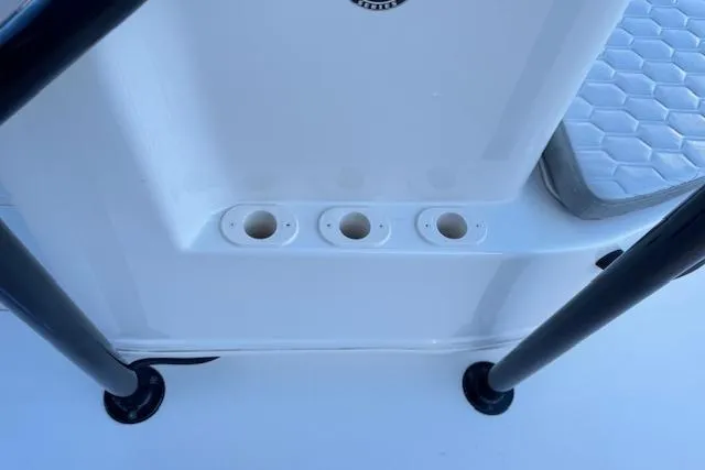 Slide: The Image of 2026 Carolina Skiff 21 LS boat interior with rod holders and cushioned seating. - 23