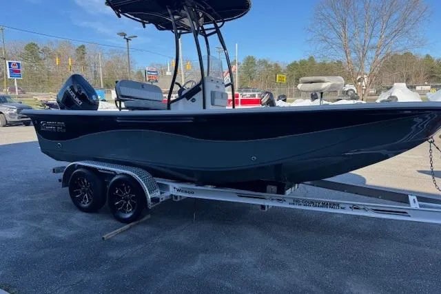 Slide: The Image of 2026 Carolina Skiff 21 LS boat on trailer, parked outdoors. - 3