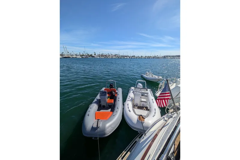 Slide: The Image of Two Tide Craft Catalina 13 boats docked on a sunny day, 2026 model. - 12